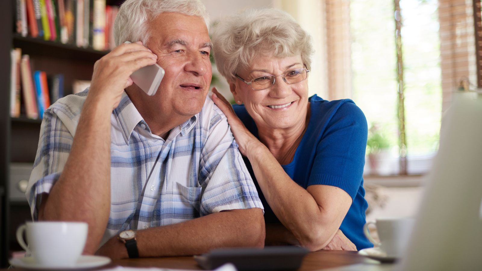 elderly couple calling on phone